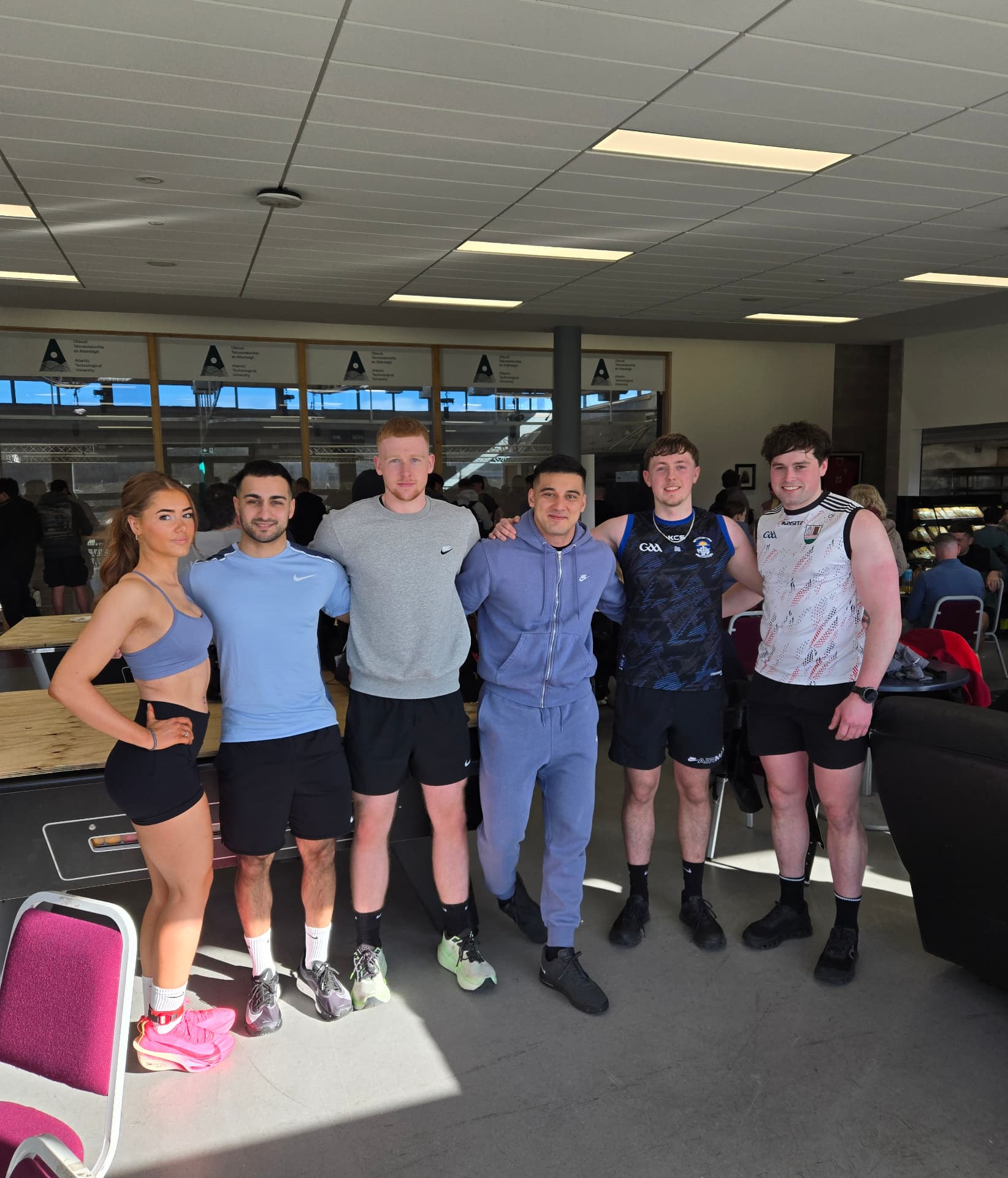 Coach M.M.X and clients after a session at the university gym