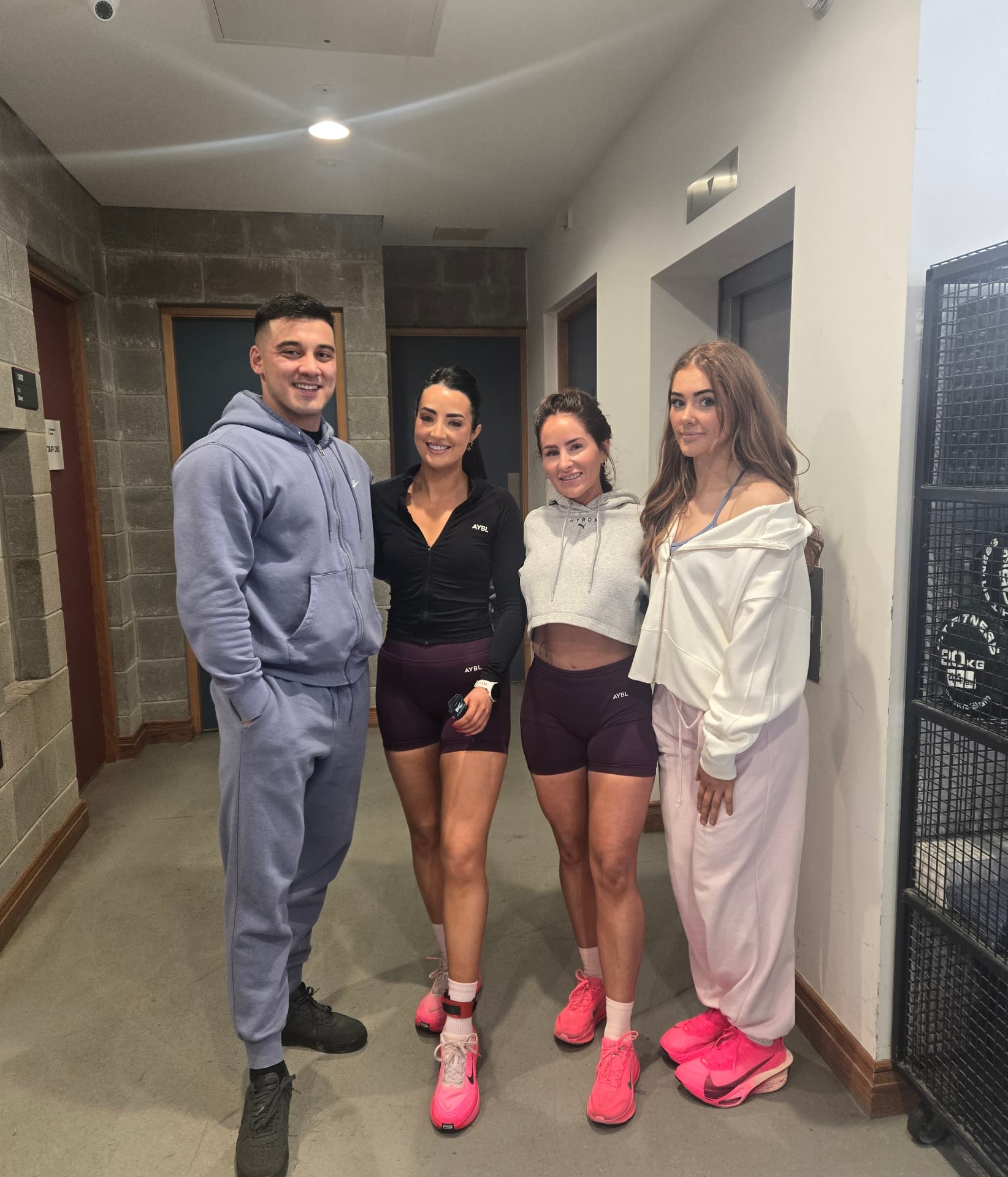 Coach M.M.X with three female clients after training