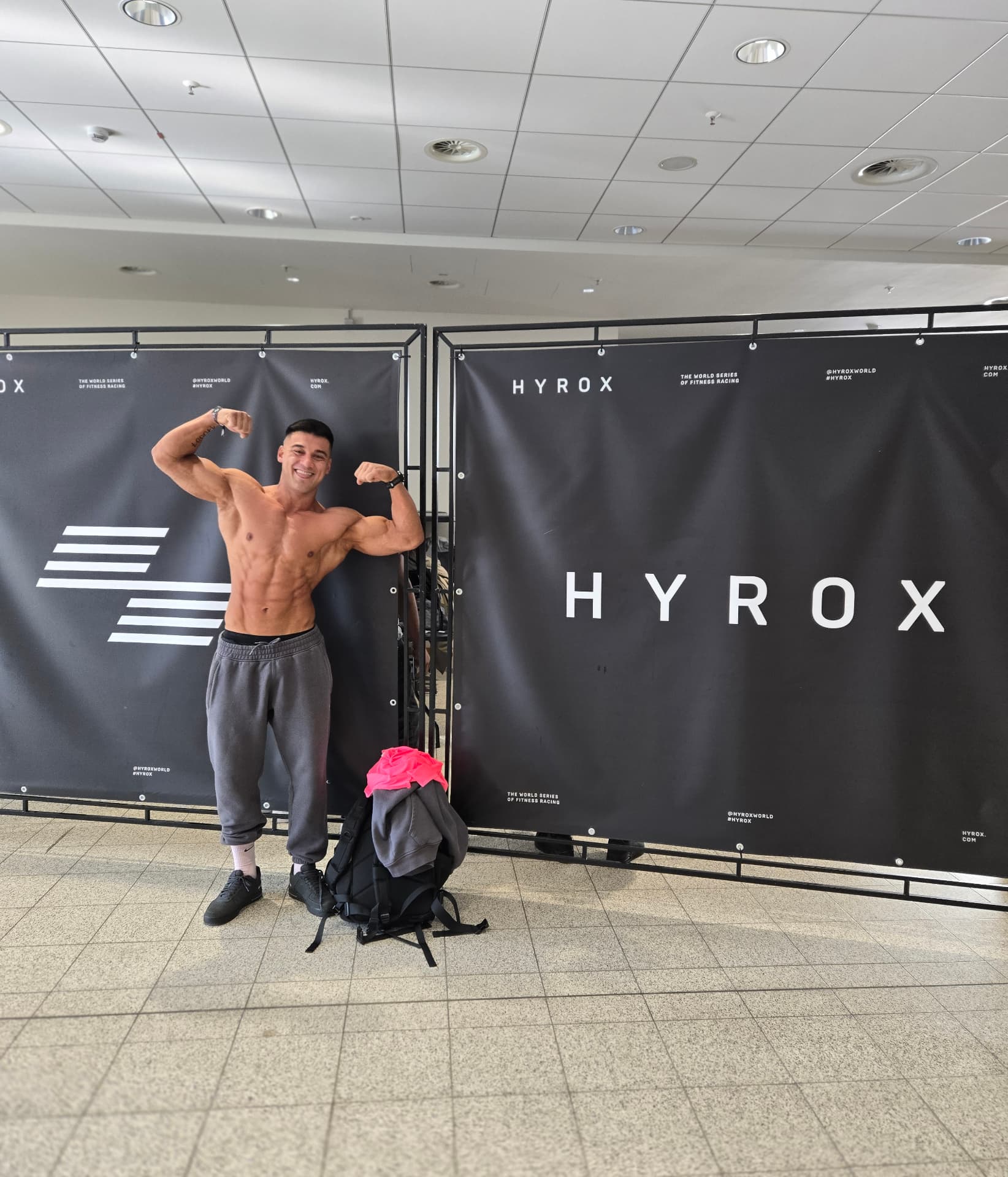 Flexing in front of the HYROX event backdrop