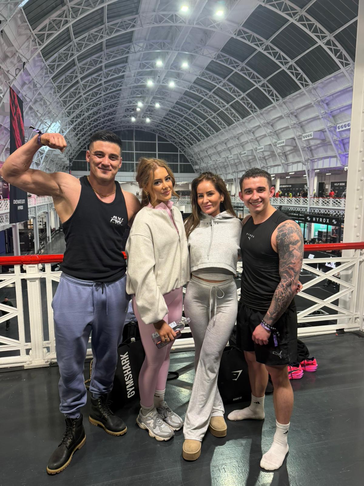 Coach M.M.X with clients at the HYROX London arena